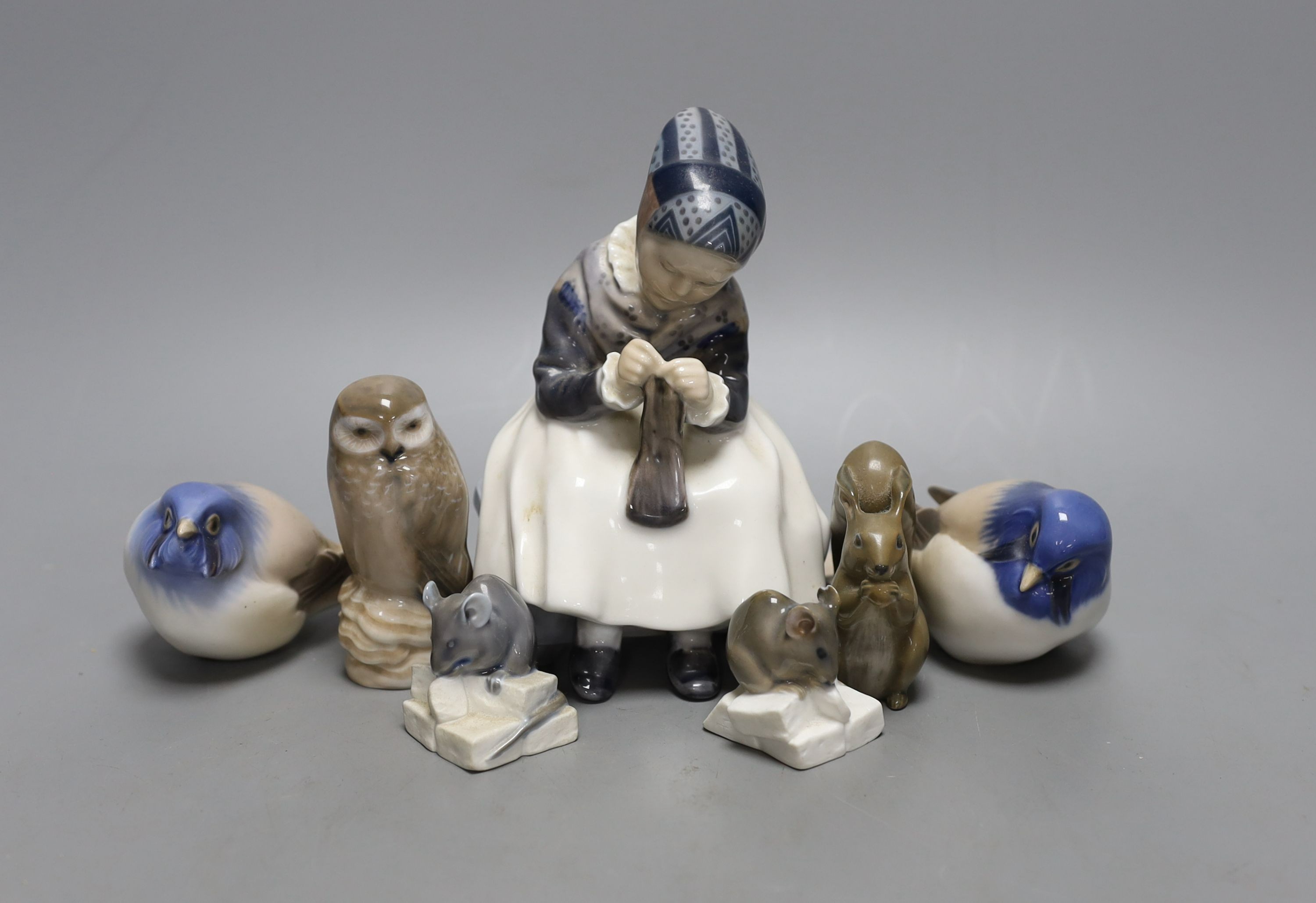 A Royal Copenhagen figure of a girl, three birds and three animals